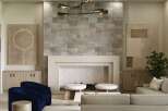 Experience luxury living in this stunning property featuring a cozy fireplace with a stone accent wall, perfect for creating a warm and inviting atmosphere.