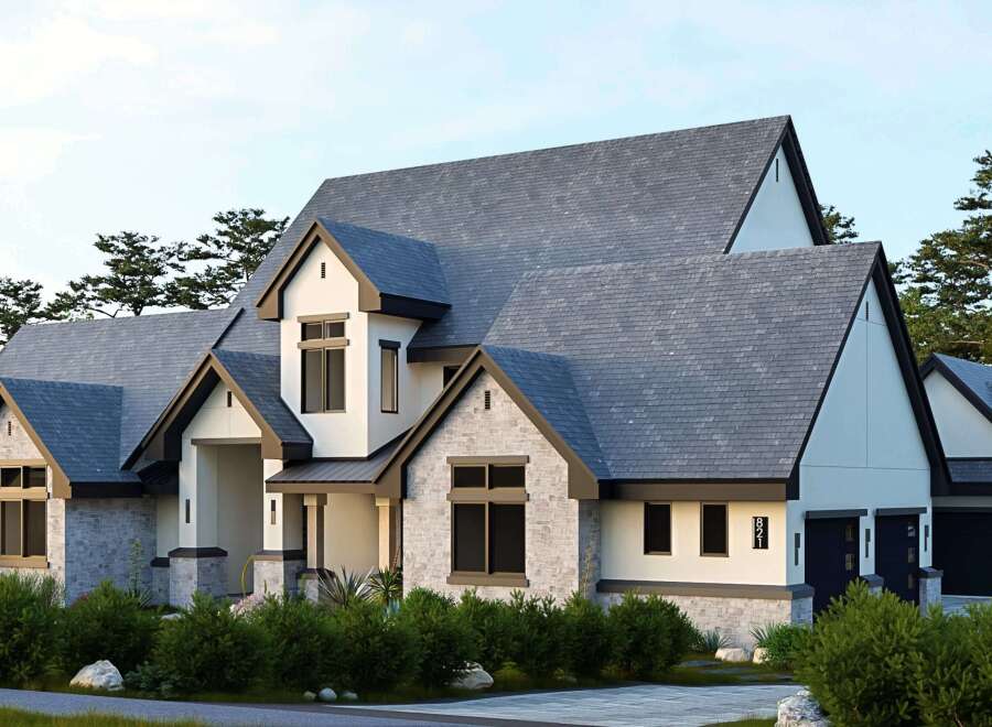 This stunning modern home boasts a beautiful exterior with a combination of stone and white siding, creating a striking contrast.