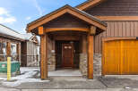 This stunning property boasts a beautiful wooden facade and a welcoming entrance.