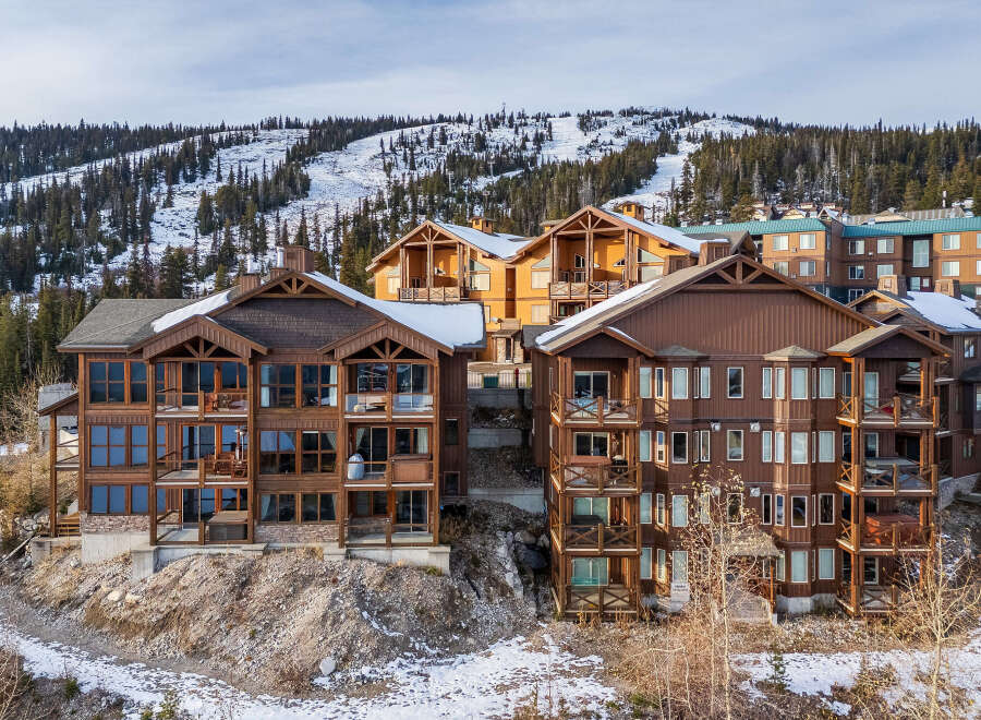 Discover luxury living in this stunning mountain property, featuring spacious units with balconies and breathtaking views.