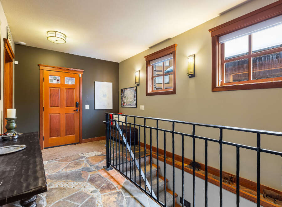 Step into this inviting entryway, showcasing a stunning combination of rustic charm and modern elegance.