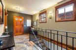 Step into this inviting entryway, showcasing a stunning combination of rustic charm and modern elegance.