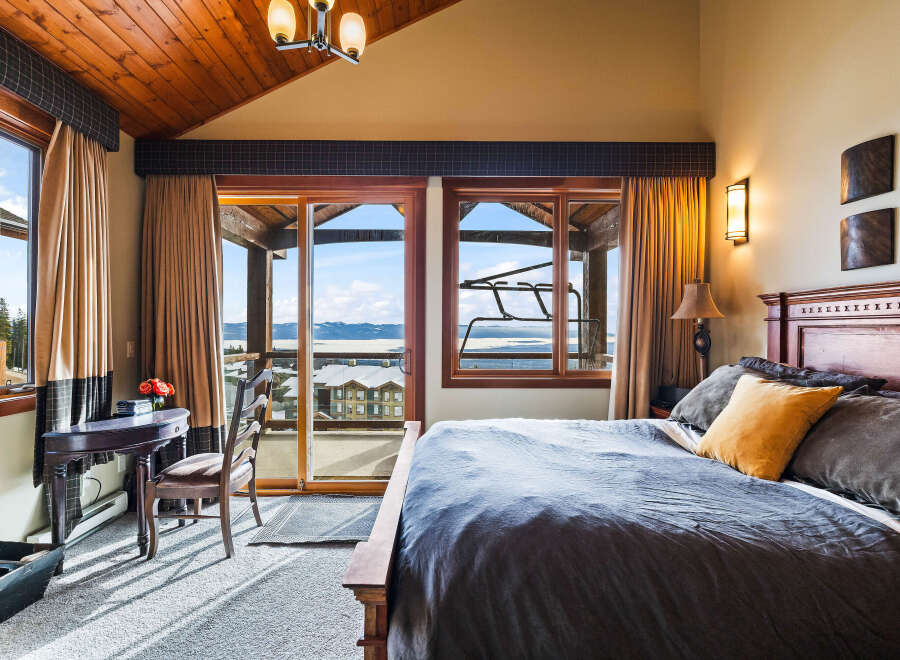 Experience luxury in this stunning bedroom with breathtaking views.
