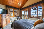 Experience luxury living in this stunning bedroom with breathtaking views.