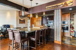 This stunning kitchen boasts a spacious island with seating, perfect for entertaining or casual dining.