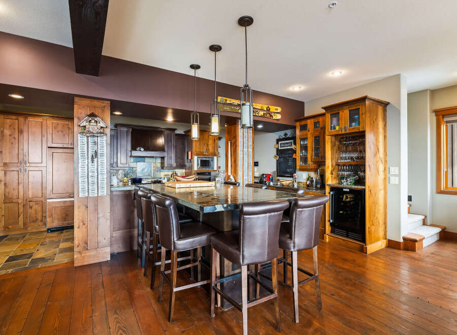 This stunning kitchen boasts a large island with seating, perfect for entertaining.