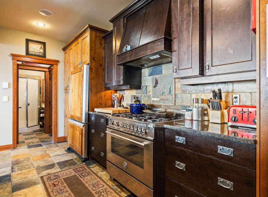This stunning kitchen boasts a modern design with high-end appliances and custom cabinetry.