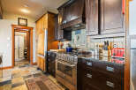 This stunning kitchen boasts a modern design with high-end appliances and custom cabinetry.