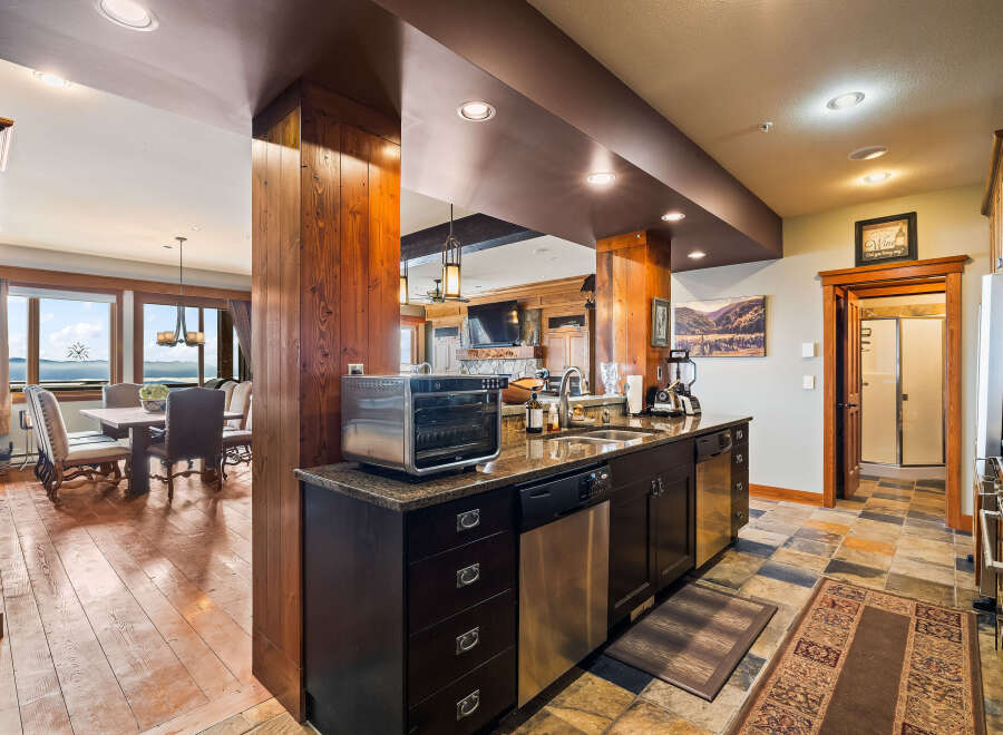 This stunning kitchen boasts a modern design with high-end appliances and ample counter space, perfect for culinary enthusiasts.