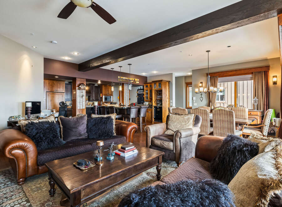 This stunning living space boasts a warm and inviting atmosphere, perfect for relaxation and entertaining.