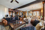 This stunning living space boasts a warm and inviting atmosphere, perfect for relaxation and entertaining.