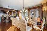 This stunning dining room showcases a rustic wooden table, perfect for family gatherings.
