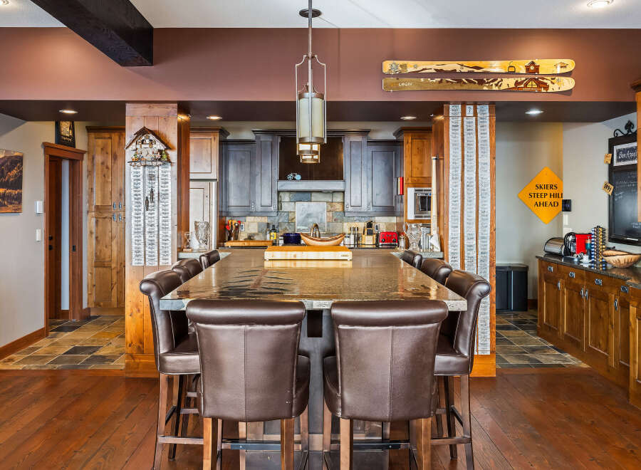 This stunning kitchen boasts a large island with seating, perfect for entertaining or casual dining.