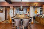 This stunning kitchen boasts a large island with seating, perfect for entertaining or casual dining.