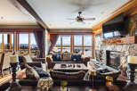 Experience luxury living in this stunning property featuring a cozy living room with a fireplace and comfortable seating.