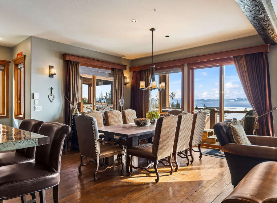 This stunning dining room boasts breathtaking mountain views, perfect for hosting memorable gatherings.