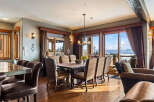 This stunning dining room boasts breathtaking mountain views, perfect for hosting memorable gatherings.