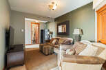 This inviting living space features a comfortable sofa and armchair, perfect for relaxing.