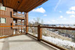 Enjoy breathtaking views from this stunning balcony overlooking a winter wonderland.