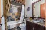 Step into this beautifully designed bathroom, featuring a stunning tile backsplash that adds a touch of elegance.