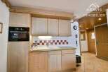 Discover the charm of this well-equipped kitchen, perfect for culinary enthusiasts.