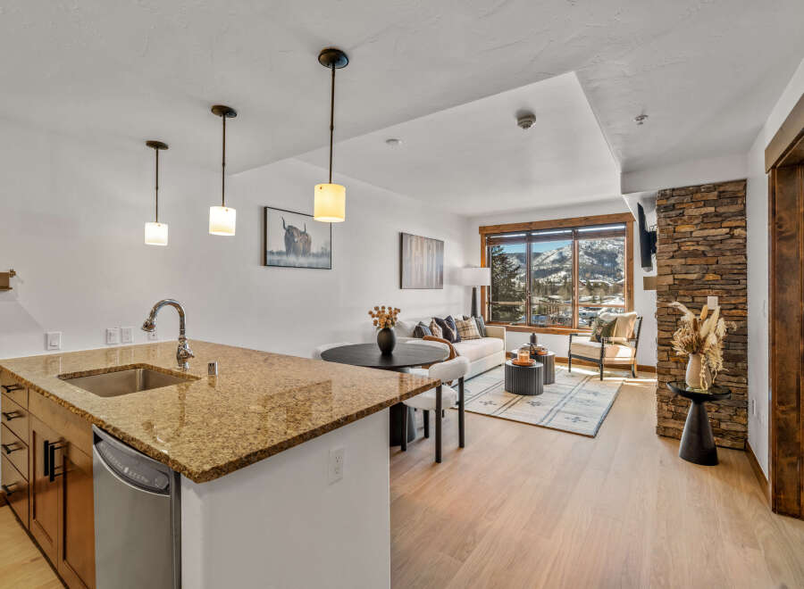 This stunning property boasts a modern kitchen with granite countertops and stainless steel appliances, perfect for culinary enthusiasts.
