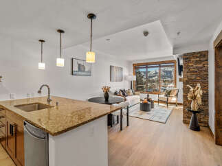 This stunning property boasts a modern kitchen with granite countertops and stainless steel appliances, perfect for culinary enthusiasts.