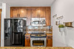 This stunning kitchen boasts beautiful wooden cabinetry, offering ample storage space.