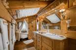 Step into rustic elegance with this charming bathroom.