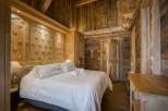Experience rustic elegance in this stunning bedroom.