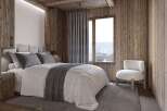 Experience the warmth and charm of this cozy bedroom, featuring rustic wooden accents and a serene ambiance.