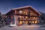 Experience luxury mountain living in this stunning chalet, featuring a private outdoor hot tub perfect for soaking in the snowy landscape.