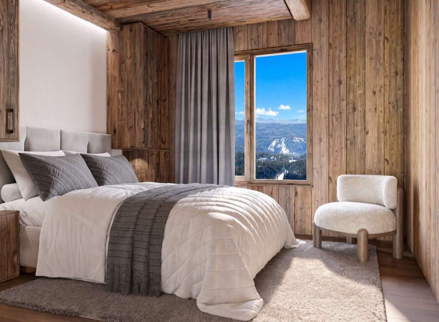 Experience the ultimate mountain retreat in this cozy bedroom, featuring rustic wood paneling and a plush bed perfect for unwinding after a day on the slopes.