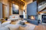 Experience luxury living in this stunning property featuring a cozy fireplace, perfect for chilly evenings.