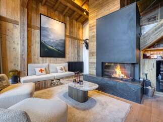 Experience luxury living in this stunning property featuring a cozy fireplace, perfect for chilly evenings.