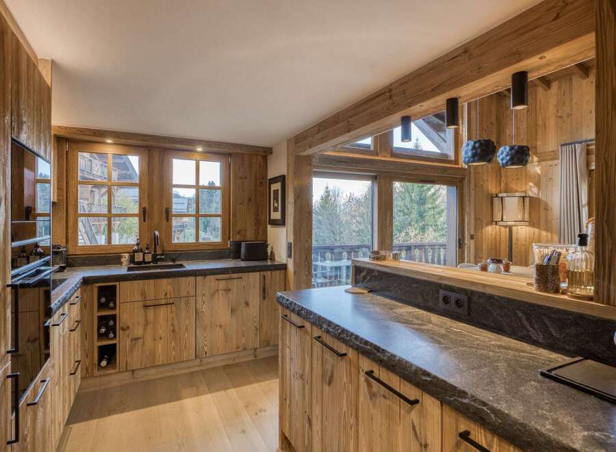This stunning kitchen showcases a rustic yet modern design, perfect for a luxury home.
