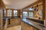 This stunning kitchen showcases a rustic yet modern design, perfect for a luxury home.