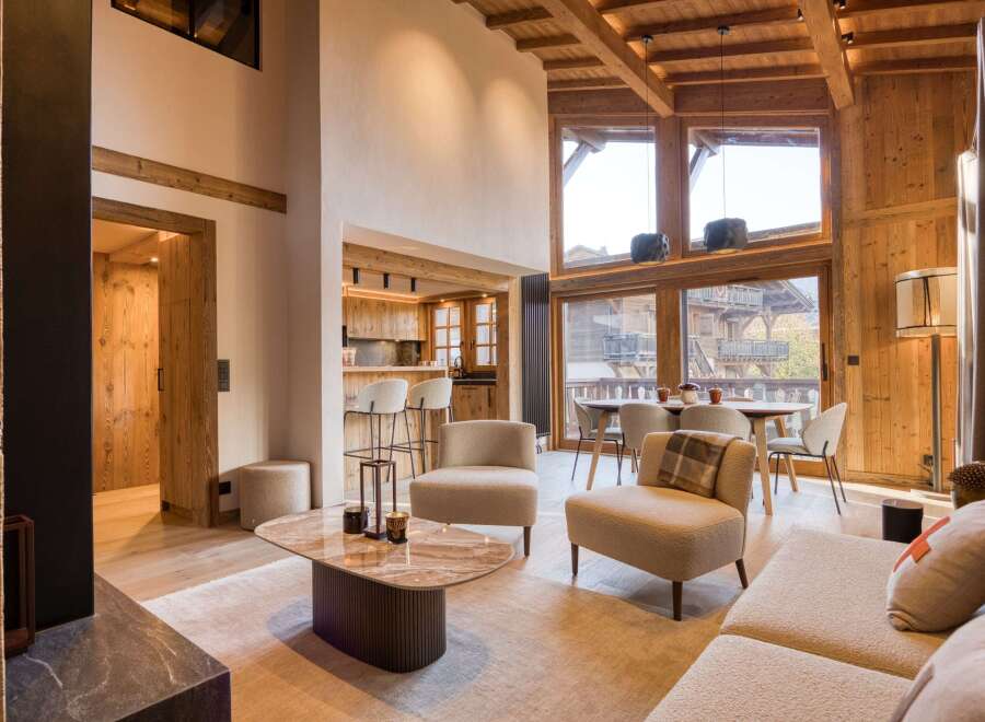 Experience luxury living in this stunning property, featuring a spacious living area with high ceilings and natural light.