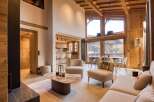 Experience luxury living in this stunning property, featuring a spacious living area with high ceilings and natural light.