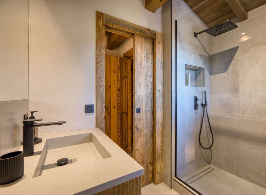 Step into luxury with this stunning bathroom featuring a sleek, modern design.
