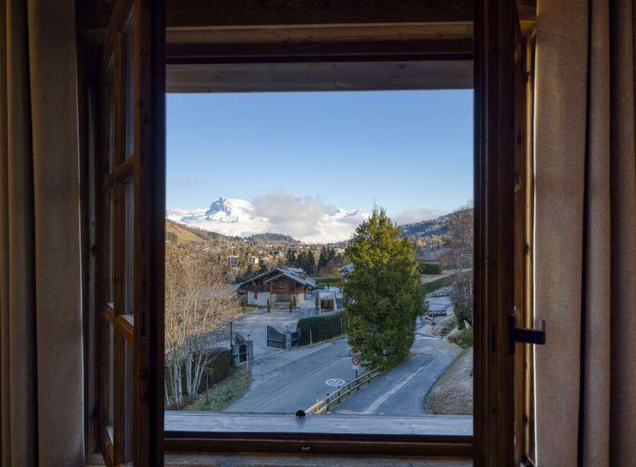 Enjoy breathtaking mountain views from this charming property.