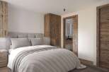 Experience the epitome of rustic elegance in this stunning bedroom.