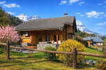 Escape to the tranquility of this charming wooden cabin nestled in a picturesque mountain setting.