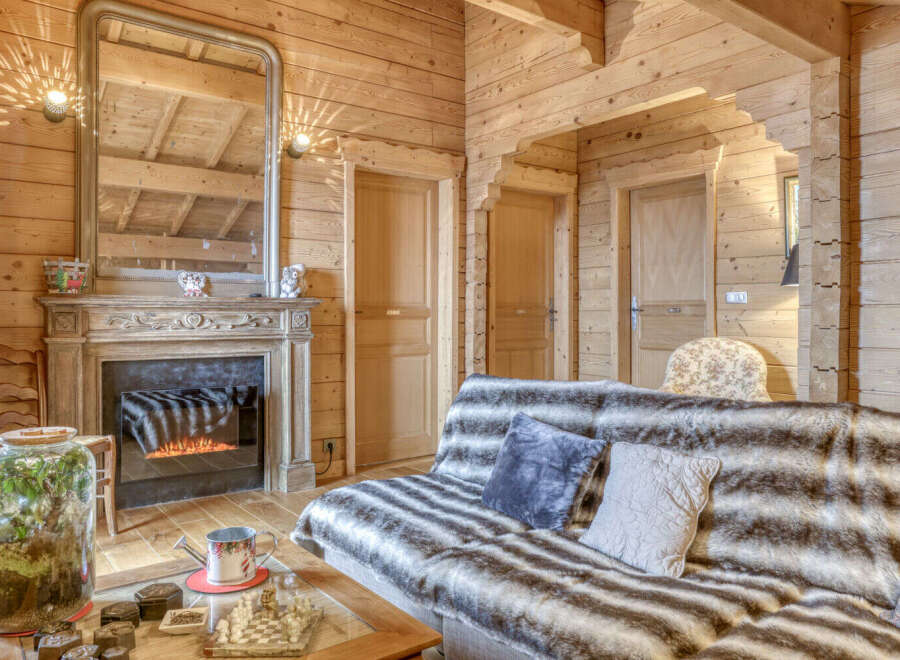 Step into a cozy retreat with this stunning property, featuring a rustic wooden interior that exudes warmth and charm.