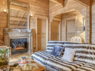 Step into a cozy retreat with this stunning property, featuring a rustic wooden interior that exudes warmth and charm.