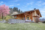 Discover the charm of this stunning wooden chalet nestled in a picturesque setting.
