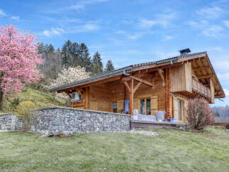 Discover the charm of this stunning wooden chalet nestled in a picturesque setting.