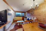 This cozy living space features a warm wooden interior, creating a welcoming atmosphere.