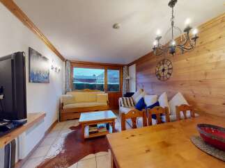 This cozy living space features a warm wooden interior, creating a welcoming atmosphere.