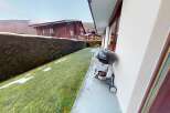 Enjoy the tranquility of this charming property, featuring a lush green lawn and a well-maintained hedge.